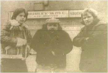 Caption: Out in the cold at Hurley W.M.C…’Ice’ guitarist Andy Radek, vocalist Mick Rutherford and drummer Steve Sheldon.