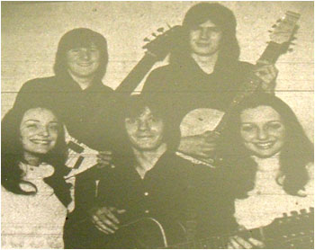 Caption: “Enigma”… five talented musicians. From left to right they are: back row: Wilf Tudor (bass), Phil Bates (lead), Front: Joy Strachan, Mike Smith, Lesley Creed.
